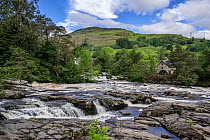 Falls of Dochart in the village Killin and the Old Mill / St Fillan's Mill, Loch Lomond & The Trossachs National Park, Stirling, Scotland, UK, June 2017
