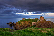 Dark clouds above Dunnottar Castle, ruined medieval fortress near Stonehaven on cliff along the North Sea coast, Aberdeenshire, Scotland, UK, May 2017