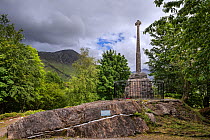 Monument with Celtic cross commemorating the Massacre of the Clan MacDonald of Glencoe in 1692, Glen Coe, Lochaber, Scottish Highlands, Scotland, UK, June 2017