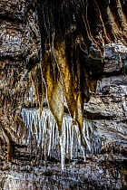 Flowstone, sheetlike deposits of calcite suspended from ceiling in the Caves of Han-sur-Lesse / Grottes de Han, Ardennes, Belgium