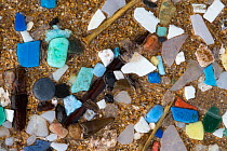 Marine microplastics (particles with upper size limit of 5mm) washed up on a beach in  Pembrokeshire, Wales, UK. January.