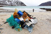 Child gathering marine pollution from beach, Troms, Norway, May 2017. Winner of the Threatened Nature category of the Nordic Nature Photo Contest (NNPC) 2018. Model released.
