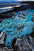 Discarded plastic rope and commercial fishing netting washed up on shore at Luskentyre, South West Harris, Western Isles / Outer Hebrides, Scotland, May 2016