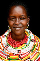 Samburu woman with her traditional coloured necklaces, head portrait, near Samburu National Reserve, Kenya. September 2017.