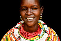Samburu woman with her traditional coloured necklaces, head portrait,  near Samburu National Reserve, Kenya. September 2017.