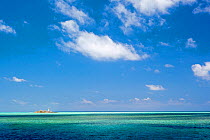 Lighthouse in distance,  Tubbataha Reef Natural Park, UNESCO World Heritage Site,  Sulu Sea, Cagayancillo, Palawan, Philippines