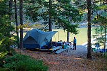 Camping on Mount Desert Island, near Acadia National Park, Maine, USA. October 2013.  Model released.