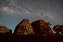 Bungle Bungle Range, at nigh with milky way. Beehive shaped karst sandstone formation formed by erosion, with dark lines formed by cyanobacteria. Purnululu National Park, UNESCO World Heritage Site, K...