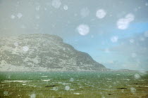 Hail over the sea with bokeh effect caused by the hailstones,  Flakstadoya, Norway, March 2012.
