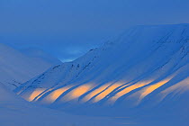 Sunlight shining on ripples of the  Adventdalen, Svalbard, Norway, March 2014.