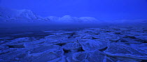 Pancake ice in Adventfjord at dusk, Svalbard, Norway, March 2014.
