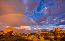 Storm clouds and rainbow over the boulders in Texas Canyon, Dragoon Mountains, Chihuahuan Desert, Arizona, USA, September 2017.