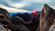 Sunrise as seen over Low's Gully and ugly sister peak, from the base of Low's peak (Approx 4000 metres) Mount Kinabalu. Borneo, May 2013.