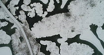 Aerial shot of lake covered by the first snow, Bindingsvann, Akershus, November Norway, November 2017.