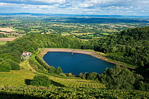 View from the Malvern Hills AONB of British Camp Reservoir, the Worcestershire Severn Plain and the Cotswolds from British Camp / Herefordshire Beacon, England, UK, August 2017.
