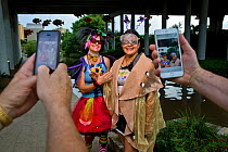 Park ranger Niki Lake poses as 'Batty the Clown' alongside her friend 'Ellie the Moth' in San Antonio where a bachelor colony of Mexican free-tailed bats (Tadarida brasiliensis) live under the bridge....