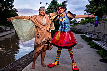 Park ranger Niki Lake poses as 'Batty the Clown' alongside her friend 'Ellie the Moth' in San Antonio where a bachelor colony of Mexican free-tailed bats (Tadarida brasiliensis) live under the bridge....
