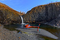 Helicopter at waterfall in Putoransky State Nature Reserve, Putorana Plateau, Siberia, Russia