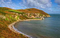 Porth Wen bay showing the ruins of the abandoned Porth Wen Brickworks, north coast of Anglesey, North Wales, UK, October 2017.