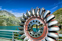 Water turbine on the dam, Lake Emerson on the French Swiss border to generate hydro electric power, Chamonix, Alps, France, September 2007.