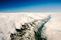 Melt water on the Greenland ice sheet near camp Victor north of Ilulissat, Greenland, July 2008.