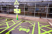 Electric car recharging station at the Charnock Richard M6 motorway service station, Lancashire, England, UK. April.
