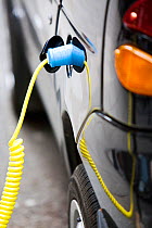 Electric vehicle at a recharging station on the street in Berkeley Square, London, UK. May 2012.