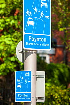 Sign in Poynton village, Cheshire which has recently undertaken a shared space road experiment, where pedestrians and vehicles share the same space. England, UK, May 2012.