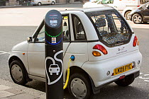A G Wizz electric car at a pavement recharging station, London, England, UK, April 2013.