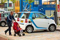 Electric Smart car at a charging station for electric cars in Ijburg, Amsterdam, Netherlands, May 2013.
