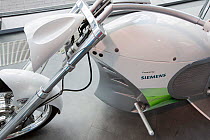 Electric motorbike as part of a sustainability exhibition at the Crystal building which is the first building in the world to be awarded an outstanding BREEAM a LEED platinum rating. London, England,...