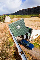 Environmentally friendly house that was built in the 1970's but still exceeds green build regulation today, at Feshiebridge, Cairngorm, Scotland, UK,  March 2012.