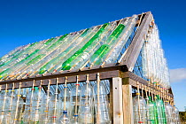Greenhouse made from waste plastic drinks bottles in the community garden at Mount Pleasant Ecological Park, Porthtowan, Cornwall, UK.