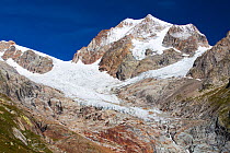 Rapidly retreating glaciers of Glacier De La Lex Blanche and  Glacier du Petit Mont Blanc on the Aiguille De Tre La Tete, Alps, Italy,  August 2014.