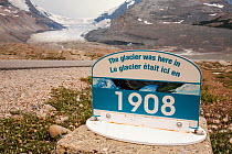 Sign marking the former extent of The Athabasca glacier. The glacier has lost 60 percent of its ice in the last 150 years. Rocky Mountains, Alberta, Canada. August 2012.