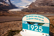 Sign marking the former extent of the Athabasca glacier, in 1925. The glacier has lost 60 percent of its ice in the last 150 years. Rocky Mountains, Alberta, Canada. August 2012.