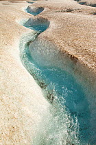 Meltwater channels on the Athabasca glacier, which has lost 60 percent of its ice in the last 150 years. Rocky Mountains, Alberta, Canada. August 2012.
