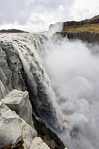 Dettifoss waterfall, the largest waterfall in Europe by volume. It is 100 metres wide and takes meltwater in the river Jokulsa a Fjollum from the Vatnajokull ice sheet. Iceland. September.