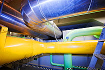 Pipes carrying steam to the steam turbines in Krafla geothermal power station. Krafla produces electricity as well as supplying hot water to heat buildings in the surrounding area. September 2010.