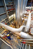 Krafla geothermal power station near Myvatn, Iceland, which produces electricity as well as supplying hot water to heat buildings in the surrounding area. September 2010.