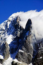 The Dru mountain above Chamonix France. Recently a massive rockfall involving millions of tons of rock was caused by meting permafrost in the high summer temperatures. Permafrost holds many alpine pea...