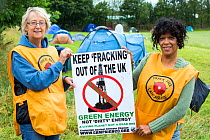 Women protestors with a protest banner against fracking at a farm site at Little Plumpton near Blackpool, Lancashire, UK, where the council for the first time in the UK, has granted planning permissio...