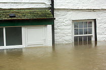 House surrounded by flood waters by the banks of the River Rothay in Ambleside, in the Lake District on Saturday 5th December 2015, during torrential rain from storm Desmond. England, UK, December 201...