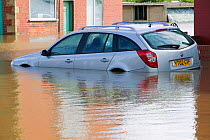 Car in flood waters in the village of Toll Bar near Doncaster, South Yorkshire, England, UK, 28th July 2007.
