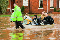 Emergency services helping people evacuate their homes, Carlisle, Cumbria, England, UK, 9th January 2005.