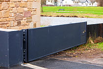 Flood gate which is part of the new flood defences in Cockermouth, Cumbria, UK.  Janaury 2013. Built after the disastrous 2009 floods that inundated large parts of the town.  They were all overtopped...