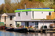 Floating house with solar panels in Amsterdam, Netherlands. May 2013.