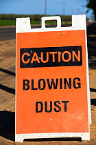 Sign warning about dust during the 2012-2017 California drought, California, USA. September 2014.