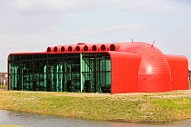 Futuristic looking building which receives hot water in an 11km long pipe from The Diemen combined heat and power plant, combined heat and power station and supplies space heating for up to 25,000 hou...
