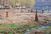 River with extremely low water level during severe drought, Tongshuan, Northern China, March 2009.